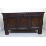 A late 18thC oak coffer with straight sides, a tri-panelled front,