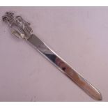 A silver paperknife,