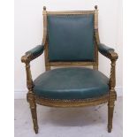 An early 20thC Continental carved giltwood framed open arm chair, the square back with finials,