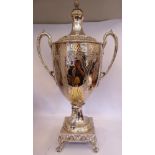 A late Victorian silver plated samovar of twin handled, pedestal vase design with a cover,