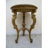 A mid/late 19thC Continental giltwood occasional table, the top set with a glazed,