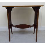 An Edwardian string inlaid and crossbanded mahogany occasional table, the figured,