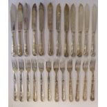 A set of twelve late Victorian silver Kings pattern fish knives and forks with scroll engraved