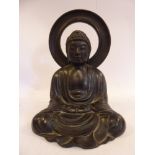 An early 20thC Asian cast and patinated bronze figure,