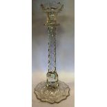 A late 19th/early 20thC cut crystal candlestick with a cup sconce and tapered column, on a domed,