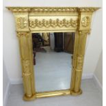 A late Victorian neo-classically inspired pier glass,