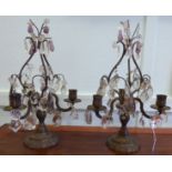 A pair of early 20thC brass table candelabra, comprising three scrolled branches,