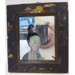 A late 19thC Japanese mirror, incorporating a painted head and shoulders portrait study,
