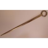 A George III silver skewer with a cast laurel wreath ring terminal indistinct London maker's mark