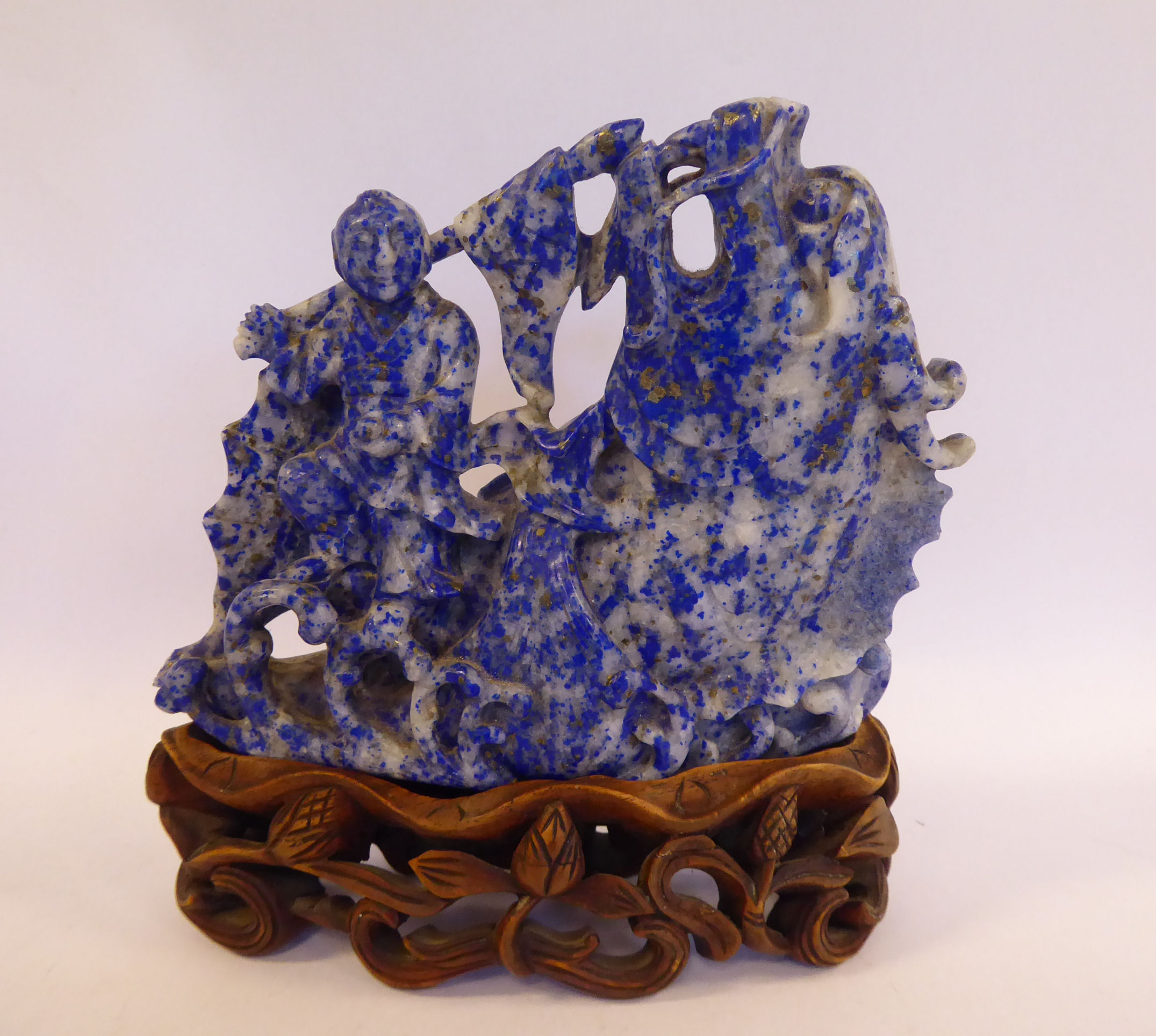 A Chinese carved lapis lazuli model, a dragon-fish emerging from cresting waves,