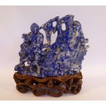 A Chinese carved lapis lazuli model, a dragon-fish emerging from cresting waves,