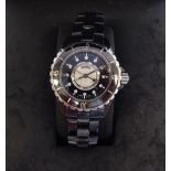 A Chanel black finished stainless steel bracelet watch, set with multiple diamonds no.