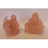 Two similar Chinese carved mottled rose quartz figures, a seated sage, holding a scroll 3.