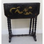 A late Victorian lacquered side table, overpainted in gilt with dragons and insects,