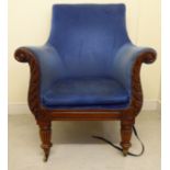 A William IV mahogany lyre front library chair with a low arched, round back,