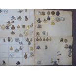 Approx sixty military cap badges and other insignia,