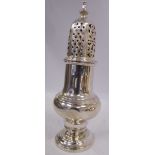 A silver caster of pedestal vase design, the decoratively pierced,