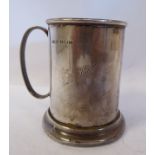 A silver Christening mug of cylindrical form with an applied wire rim and loop handle HE/JH