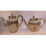A Carl Frey & Sohne German silver coloured metal vertically reed moulded coffee pot and hot water