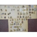 Approx sixty military cap badges and other insignia,