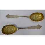 A pair of late Victorian silver and parcel gilt berry spoons,