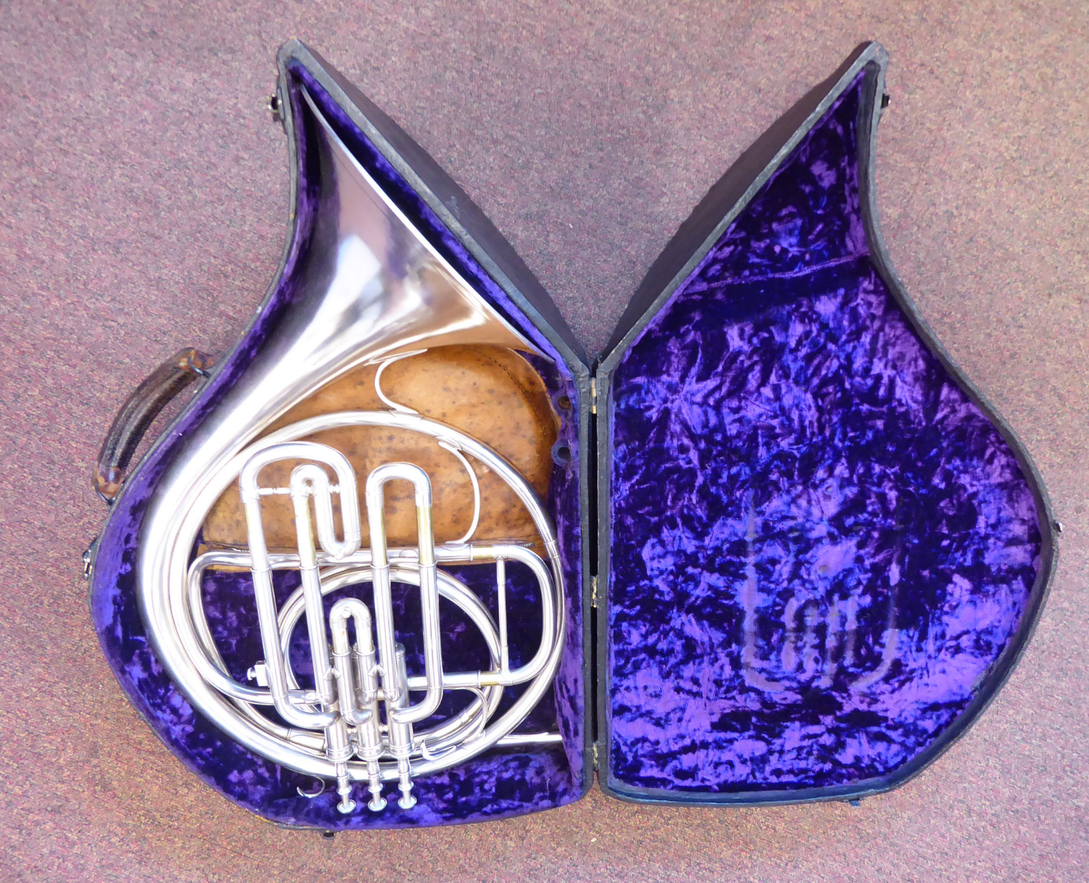 A B&H piston French horn, in a fitted, fabric lined,