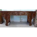 A 20thC Chinese elm altar table, having a mitred and panelled top,