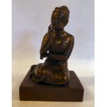 A cast and patinated bronze figure, a kneeling Asian woman,