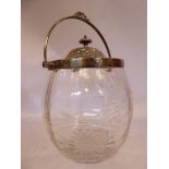 An Edwardian slice and facet cut glass biscuit barrel, having floral and foliate designs,