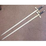 A pair of 20thC Wilkinson dress swords with wire bound handgrips and pictorially etched blades