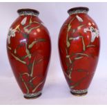 A pair of early 20thC Japanese cloisonne vases of ovoid form, decorated with flora,