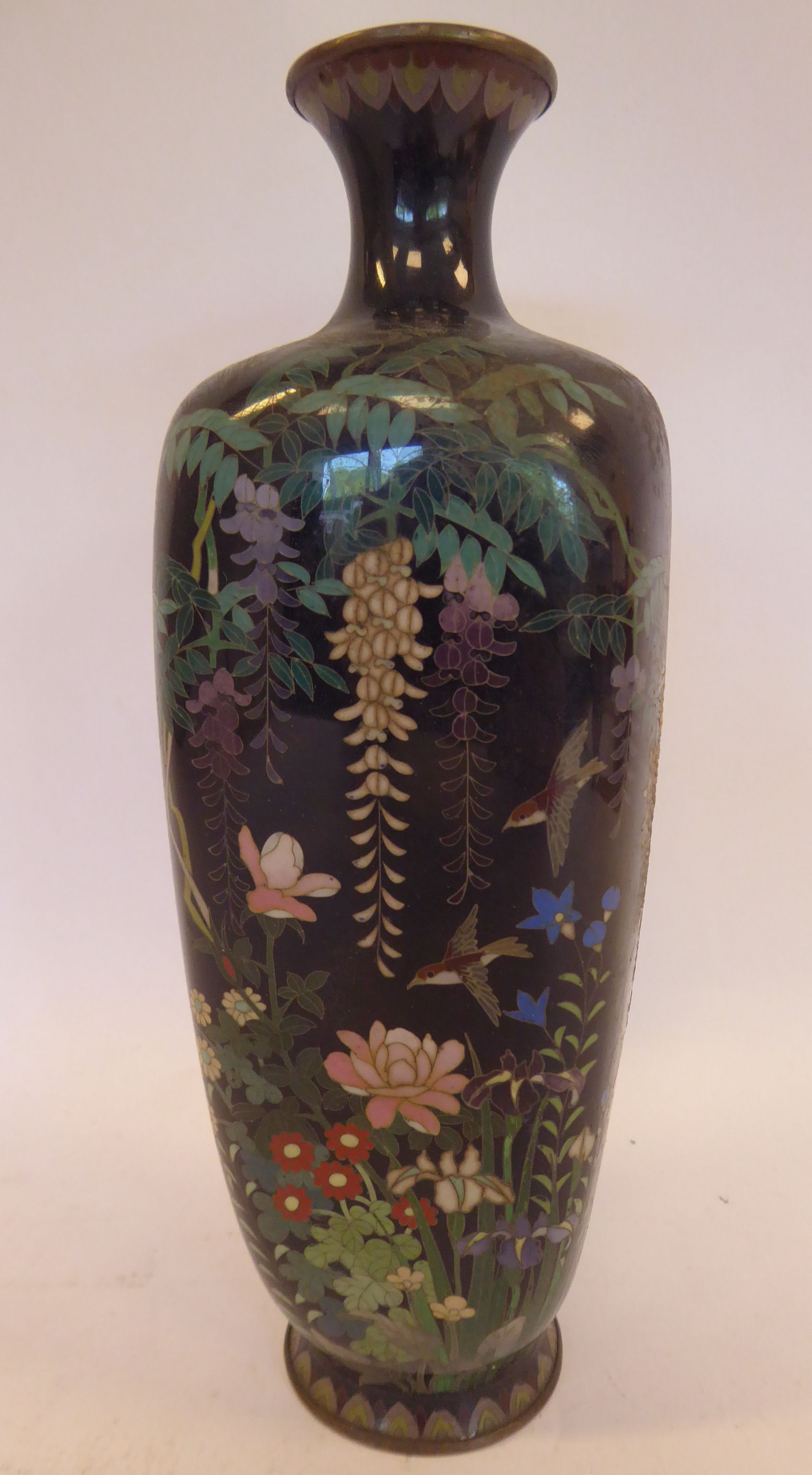 An early 20thC Japanese cloisonne vase of tapered and panelled baluster form,