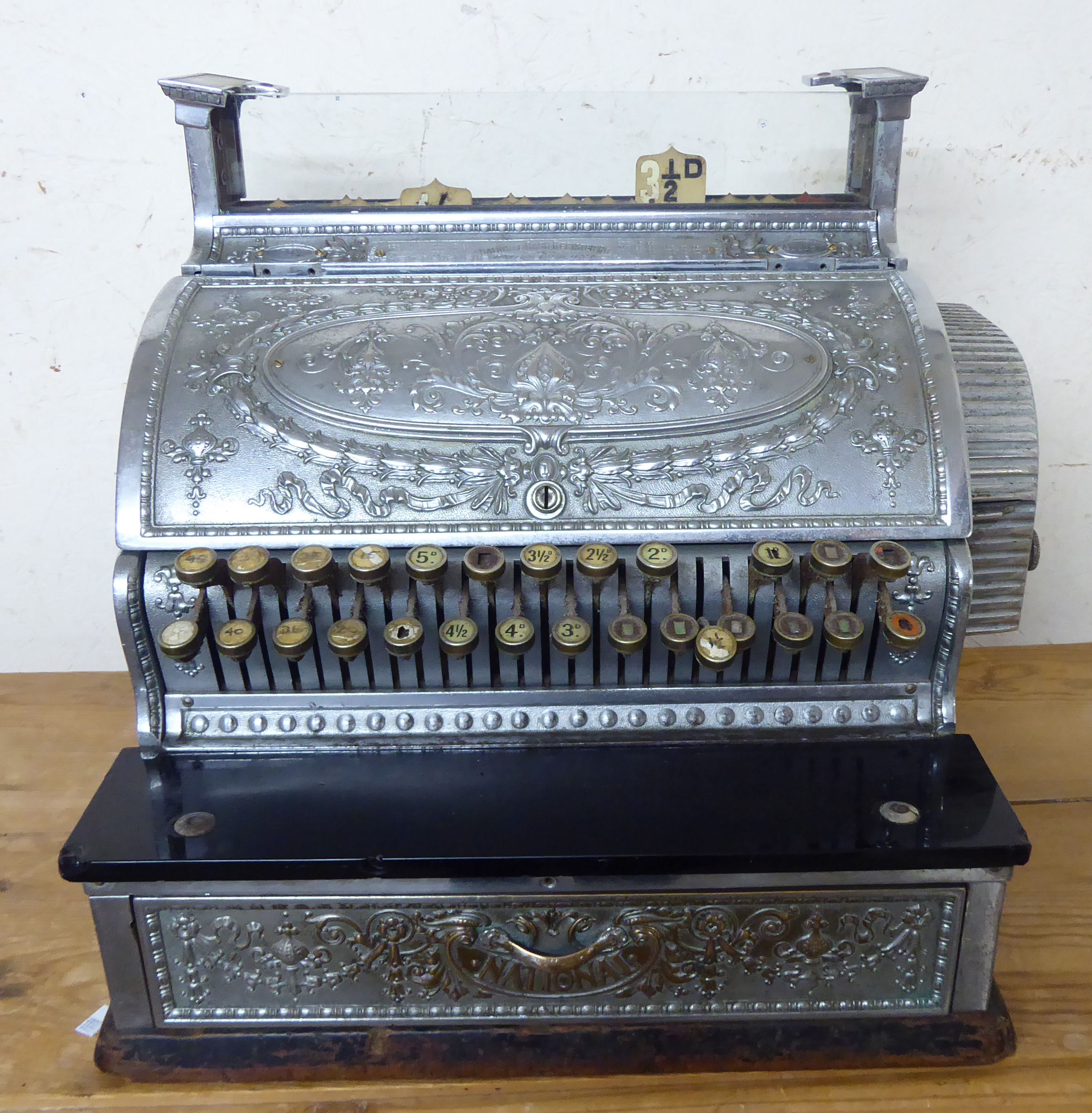 A late 19thC National Cash Register Co ornately cast silvered metal grocer's till no.