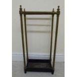 A late 19th/early 20thC tubular lacquered brass framed stickstand with turned finials,