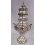 A late Victorian silver caster of pedestal vase design with opposing scrolled handles,