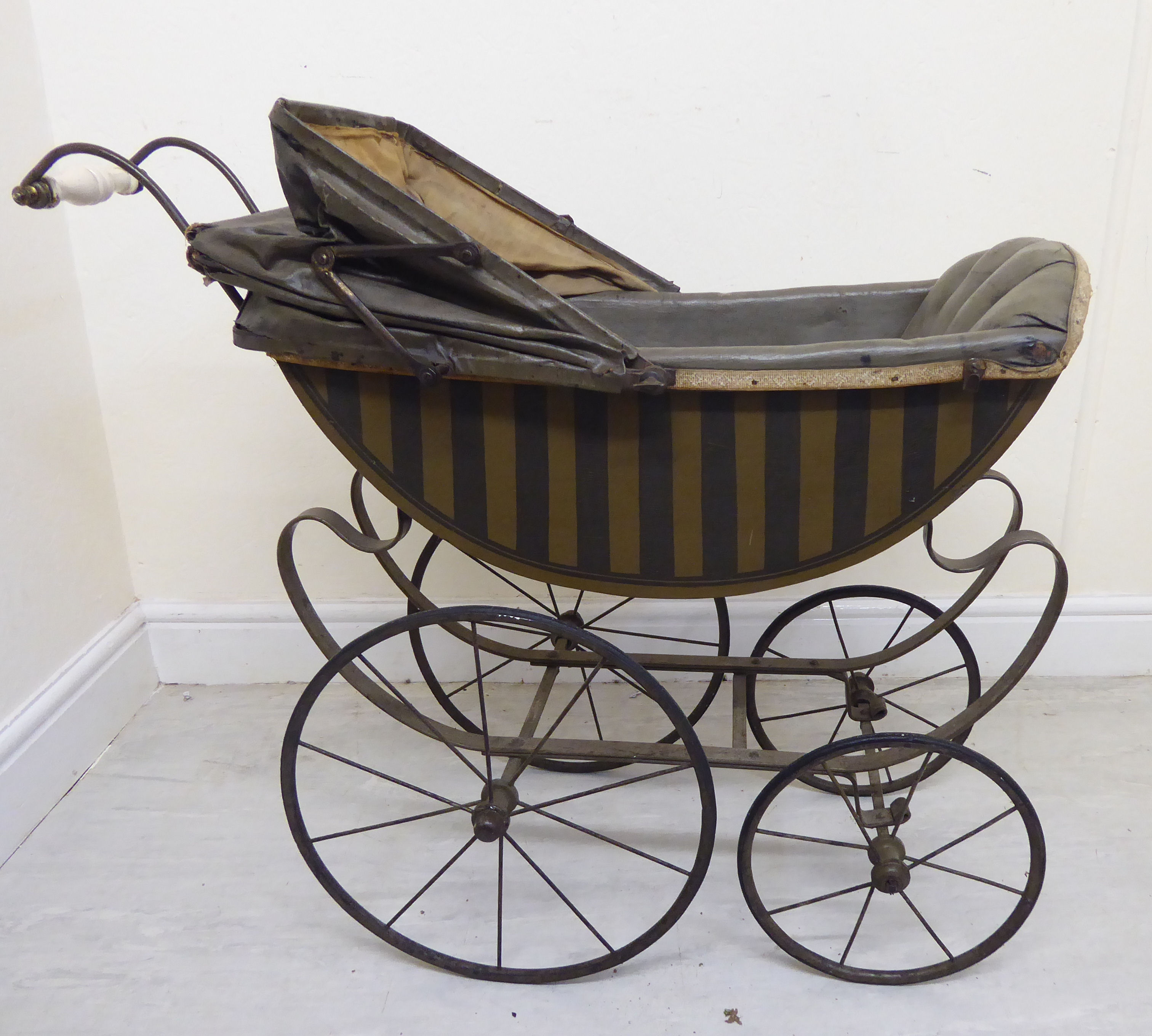 A late Victorian painted wooden dolls pram with a retractable canopy and a grey hide upholstered - Image 4 of 8