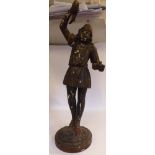A late 19thC carved, gesso moulded and painted wooden standing blackamoor figure, wearing a tunic,