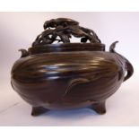 An early/late 20thC Japanese cast and patinated bronze censer of squat, bulbous form,
