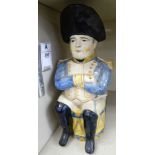 An early/mid 19thC earthenware Toby Jug, featuring a soldier wearing a uniform hat,