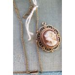 A gold coloured metal oval cameo portrait pendant,