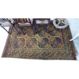 A Persian rug with eight octagonal motifs, bordered by stylised designs,