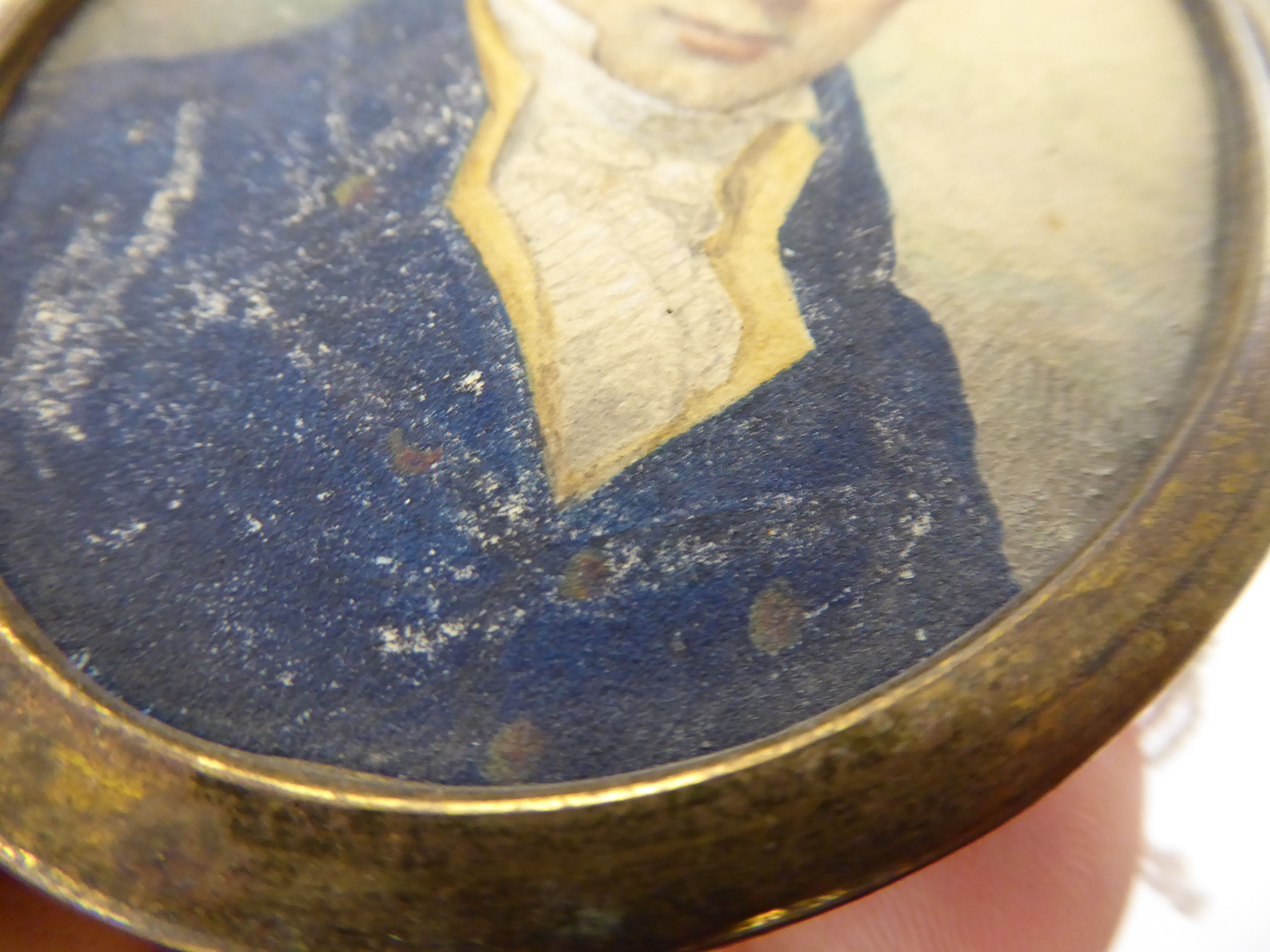 An early 19thC oval head and shoulders portrait miniature, a young man wearing a topcoat and cravat, - Image 3 of 3