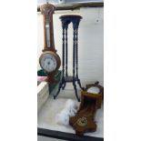 A modern blue painted hardwood jardiniere stand, elevated on spiral carved columns and splayed feet,