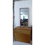 A modern teak finished modular wall unit, comprising a five drawer chest,