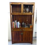 An early 1970s bespoke rosewood cabinet, the superstructure comprising three open display shelves,