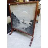 An early 20thC mahogany framed firescreen, set with a contemporary Japanese pictorial fabric panel,