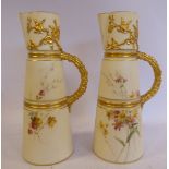 A pair of Royal Worcester blush ivory glazed china jugs of banded,