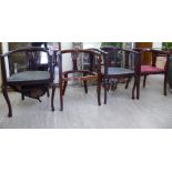 A set of four Edwardian mahogany framed splat back elbow chairs,
