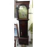 An early 19thC mahogany longcase clock, the hood with a level top, over an arched window,