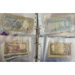 A substantial collection of foreign currency banknotes: to include Algeria, Indonesia, Spain,